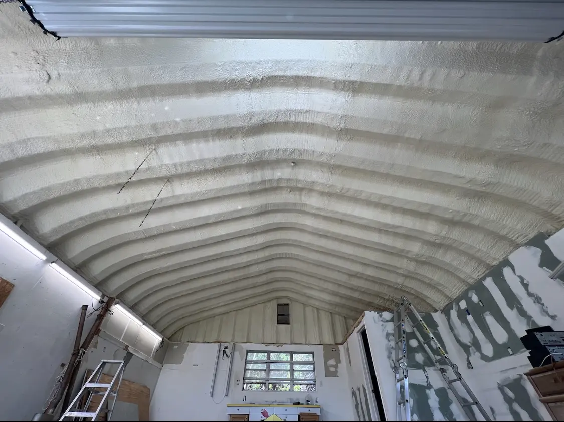 Spray polyurethane foam applied to the underside of a metal roof deck in Roseburg